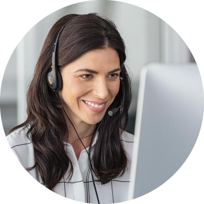 Woman wearing headphones at computer